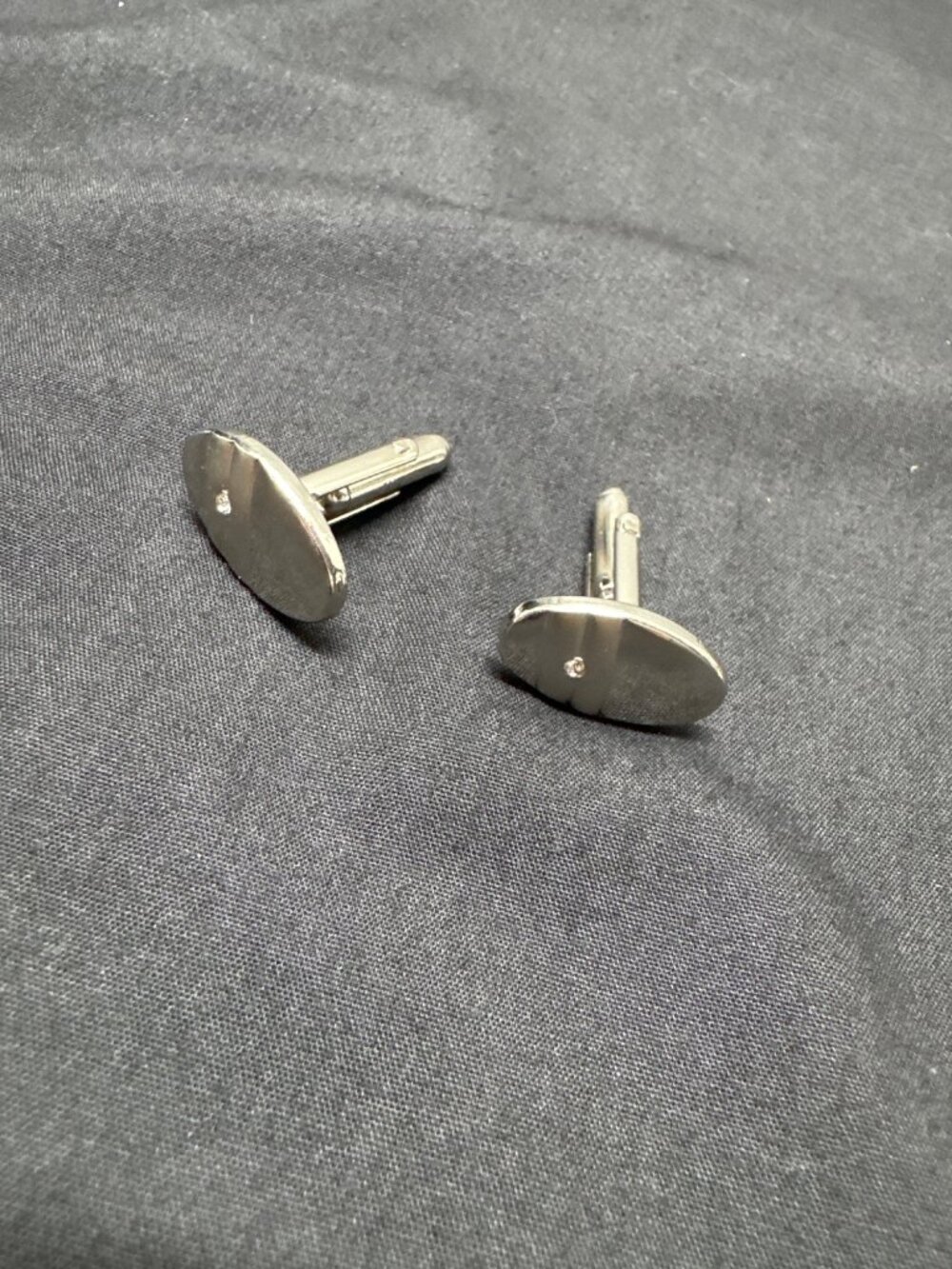 Silver Oval Cufflinks With Textured Back & Single Diamond Accent For Men
